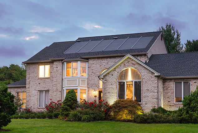 Beautiful home with large garden had energy solar roof shingle installation